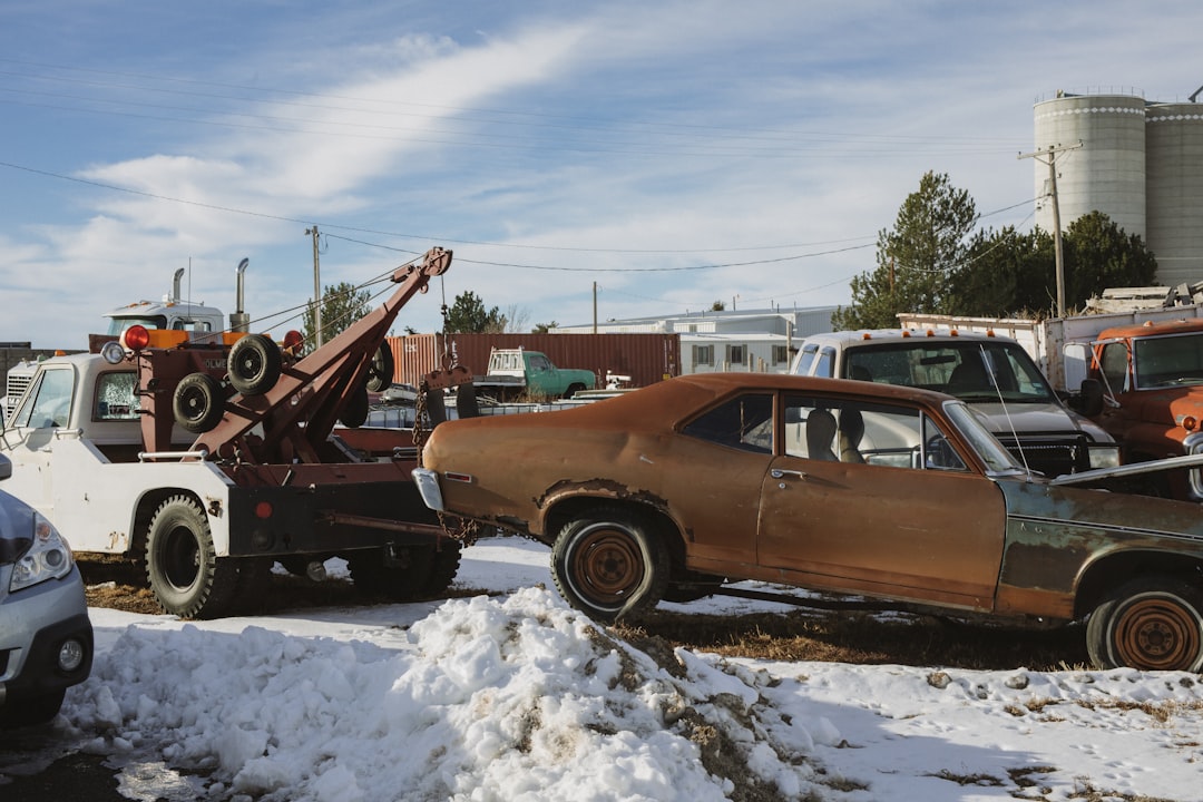brown-and-white-vintage-car-on-snow-covered-ground-during-daytime-h1n2fappqzo